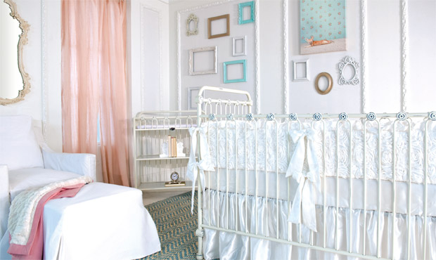 This light and airy nursery maximizes pure, soothing white space while creating excitement with pops of pink and tiffany blue. The beautiful mirror and sheer linen curtains add to the sense of vintage elegance throughout.
