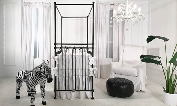 This sparse contemporary nursery is everything. The bold black four poster crib adds majesty to the otherwise white space. The minimalistic look feel is perfectly balanced while the deep green leafy plant brings life. Exquisite space for your baby boy or girl.